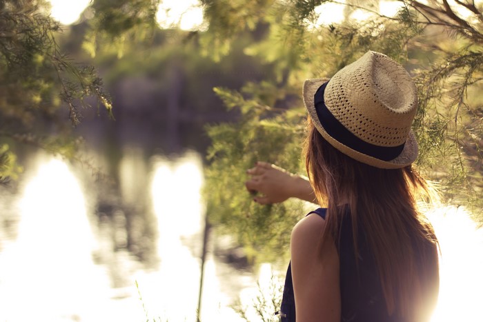 Woman in Hat by Water