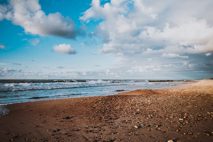 Beach with waves and clouds