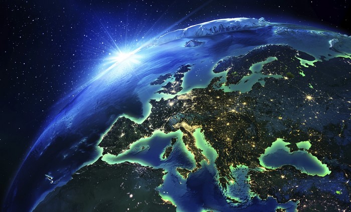 Earth from space with sun rising over Europe