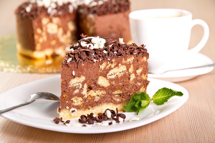 Chocolate cake slice with coffee cup