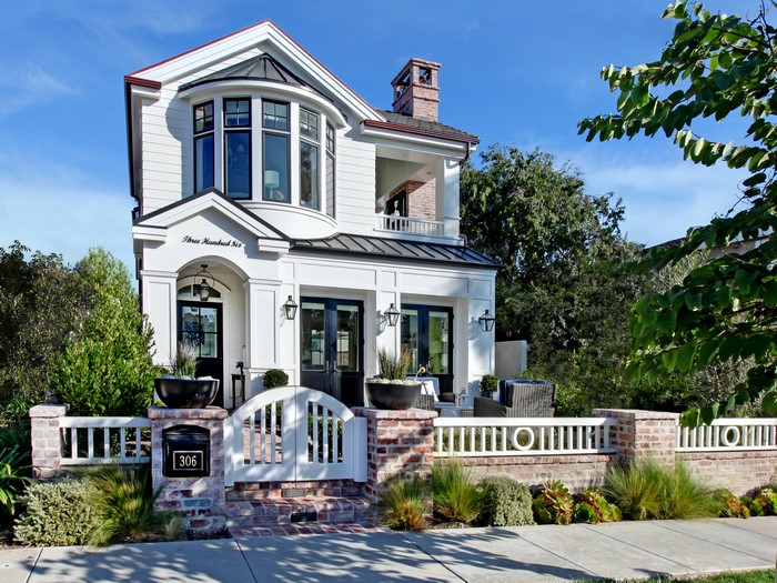 White Modern House with Brick Fence