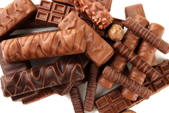 Pile of assorted chocolate bars and candies