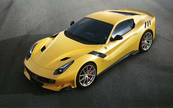 Yellow 2015 Ferrari F12tdf on Asphalt