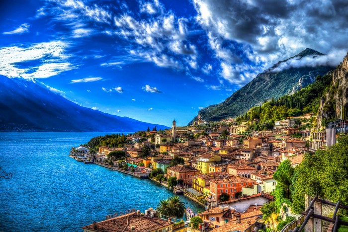 Colorful Italian town on a lake with mountains