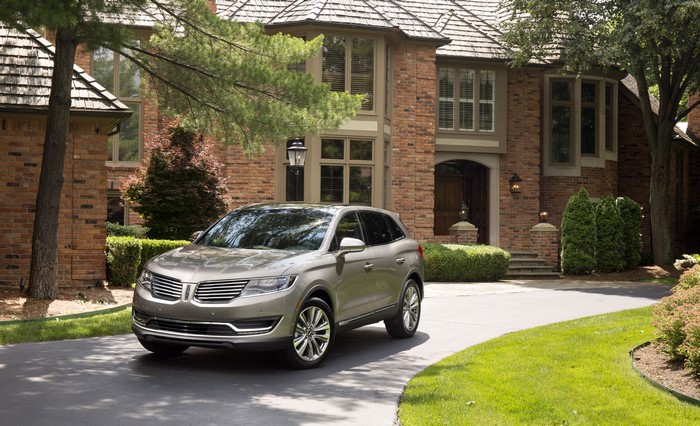2016 Lincoln MKX Metallic SUV in front of brick house