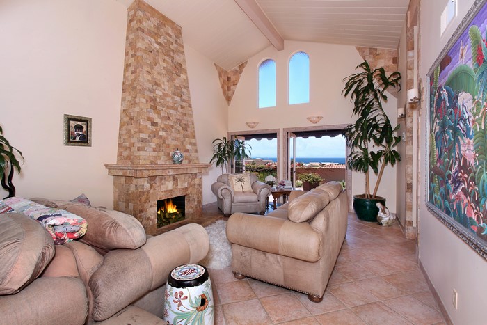 Living room with fireplace and ocean view