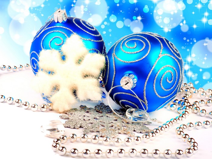 Two blue Christmas balls with snowflakes and beads