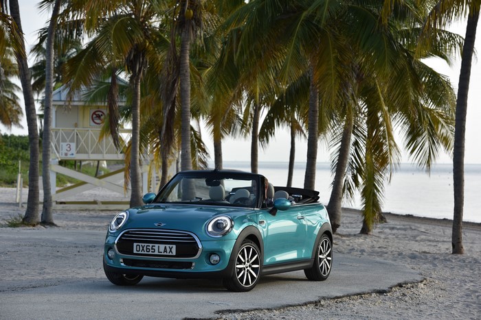 Mini Cooper Cabriolet on a beach with palm trees