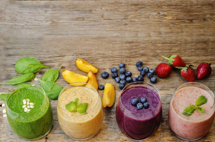 Four Smoothies with Fruits and Spinach