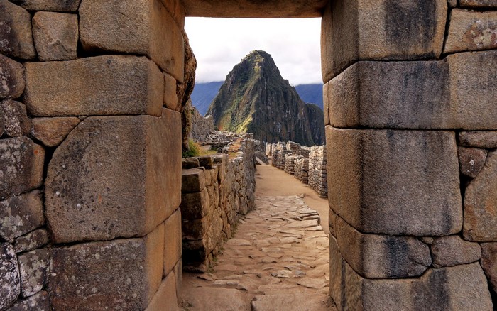 Machu Picchu ruins in Peru with mountain peak