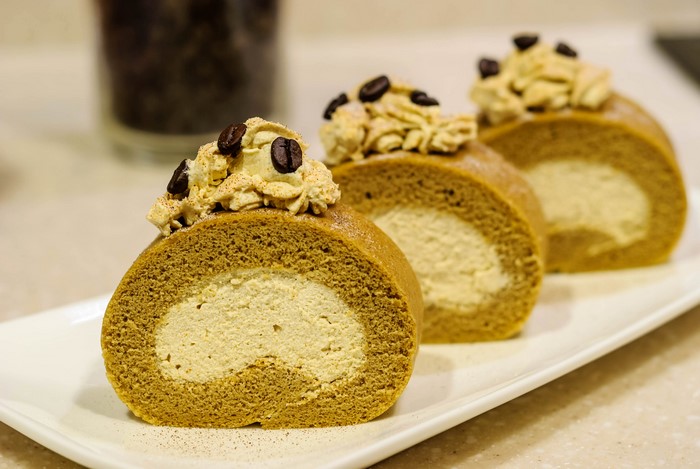 Coffee Swiss Rolls with Cream and Coffee Beans