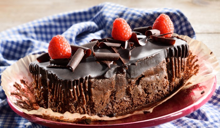 Chocolate cake with raspberries and chocolate curls
