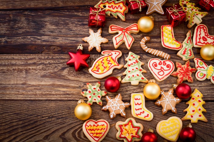 Christmas cookies and ornaments on wood planks