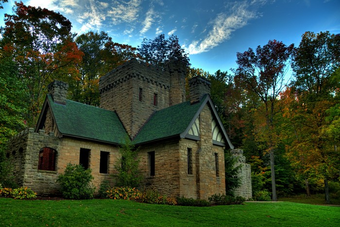 Squires Castle in a forest during autumn