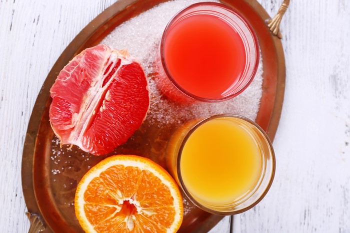 Grapefruit and Orange Juice with Fruit Slices and Sugar