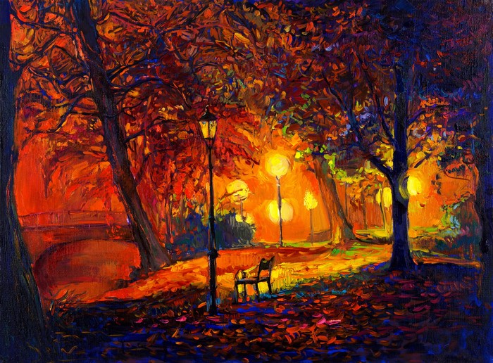 Autumn park at night with street lights and bench
