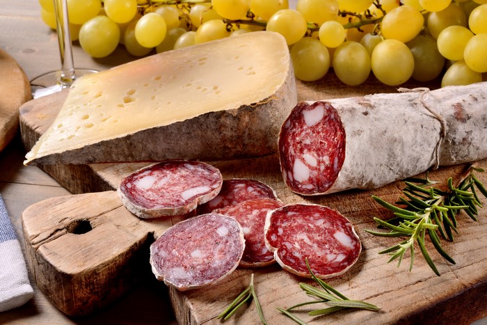 Sausage, Cheese, and Grapes on Wooden Boards