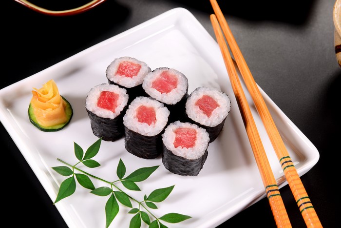 Sushi with chopsticks and ginger