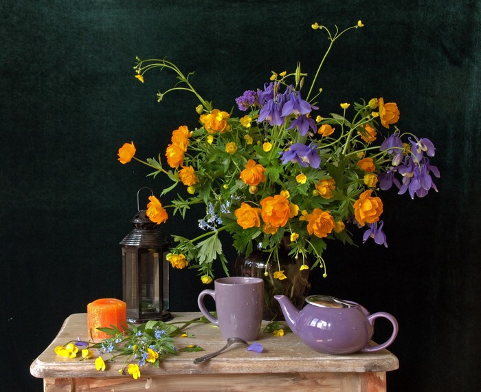 Still life with flowers, candle, cup, and teapot