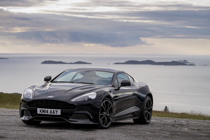 Black Aston Martin Vanquish parked by the sea