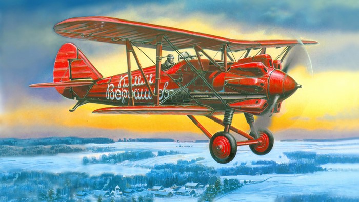 Red Polikarpov I-5 Biplane Flying Over Winter Landscape