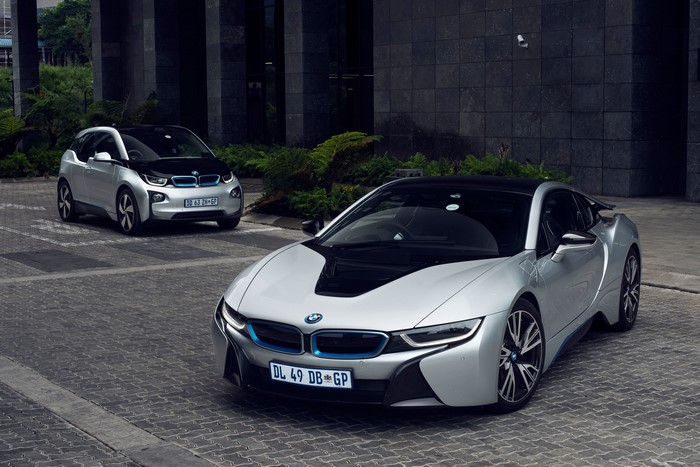 Two BMW electric cars, i8 and i3, parked outside