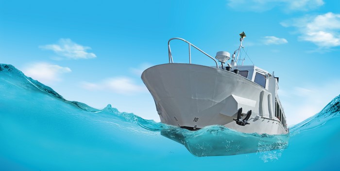 White Yacht on Blue Water Under Sky