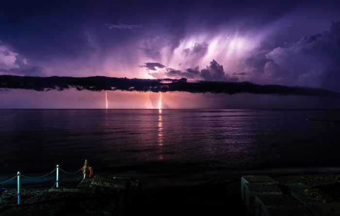 Lightning strikes over the sea in Italy