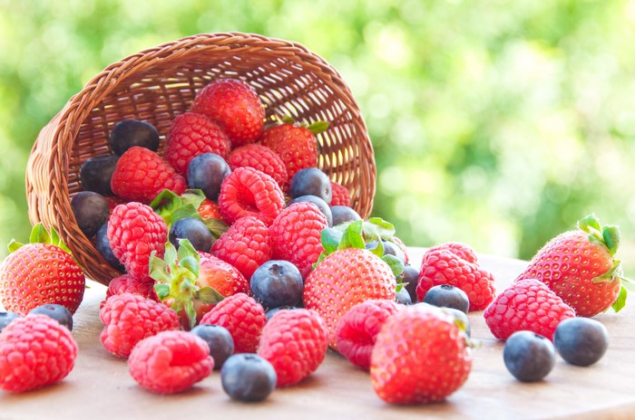 Raspberries, Blueberries, and Strawberries in a Wicker Basket