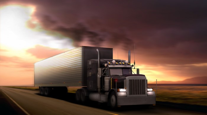 Peterbilt Truck on a Highway at Sunset