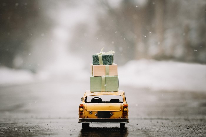 Toy taxi with gifts in the snow