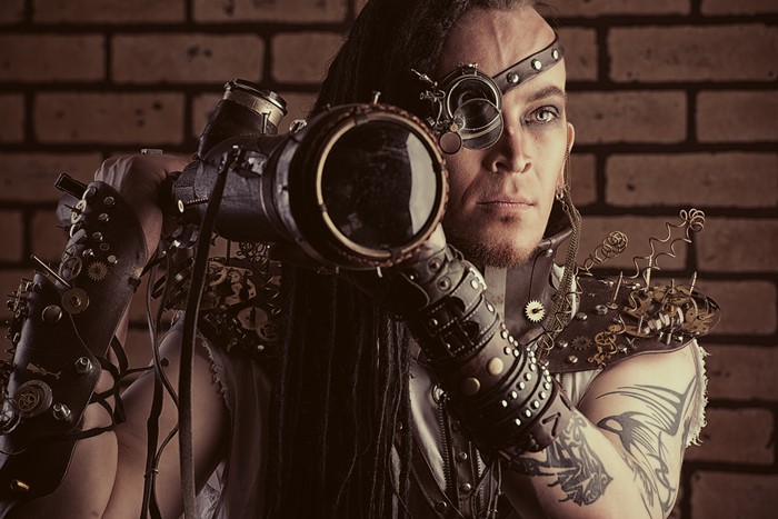 Man in Steampunk Costume with Telescope