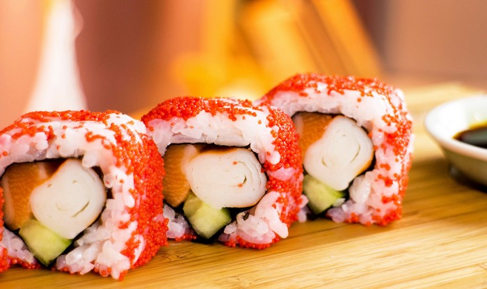 Sushi rolls with red roe and soy sauce