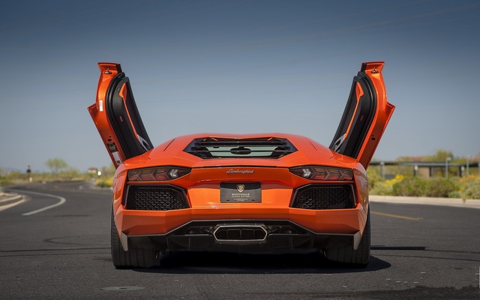 Orange Lamborghini Aventador LP700-4 with doors open