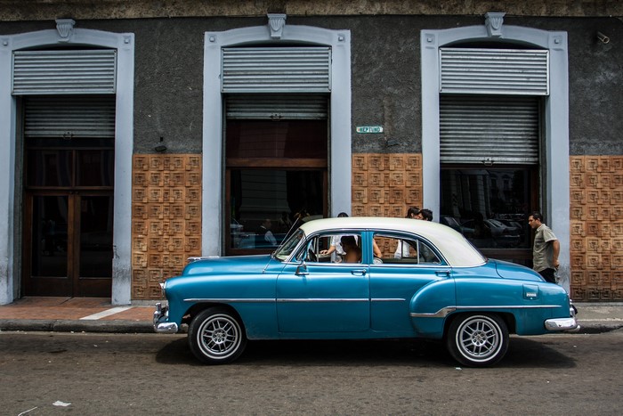 Blue and white vintage car on a street in Havana, Cuba