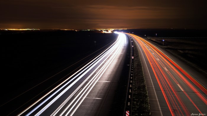 Night highway with light trails