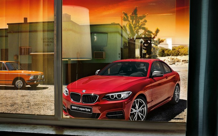 Red BMW 2 Series Coupe and Orange BMW 2002