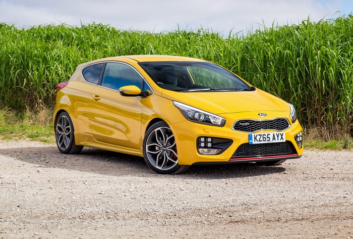 Yellow 2015 Kia Pro Ceed GT parked on gravel