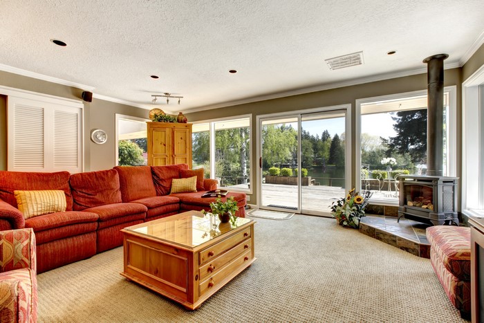Living room with red sofa and fireplace