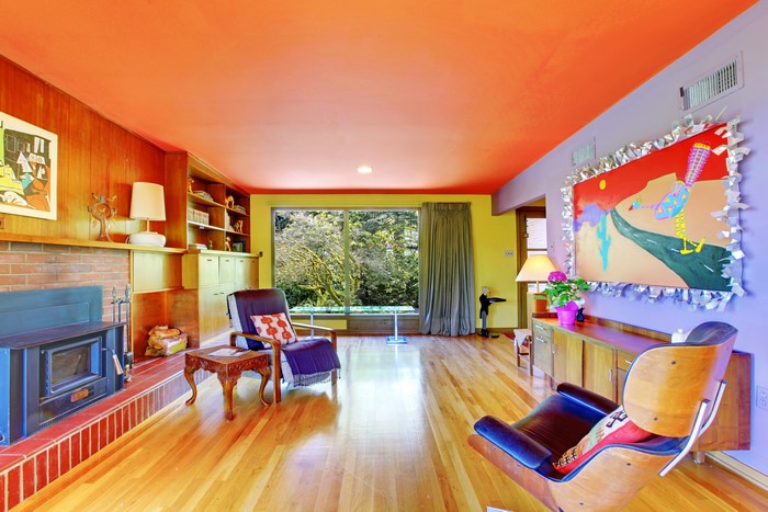Living room with orange ceiling and modern furniture