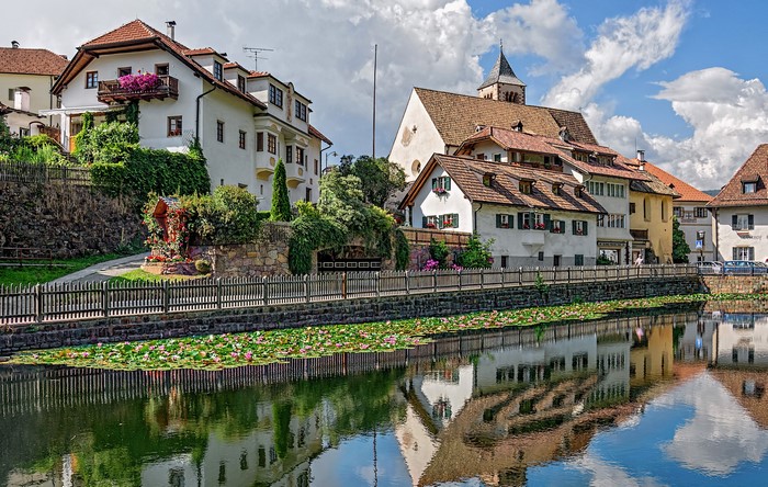 Houses and canal in Ritten, Italy