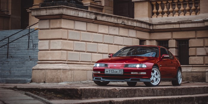 Red Honda Prelude VTEC 2.2 parked on stone steps