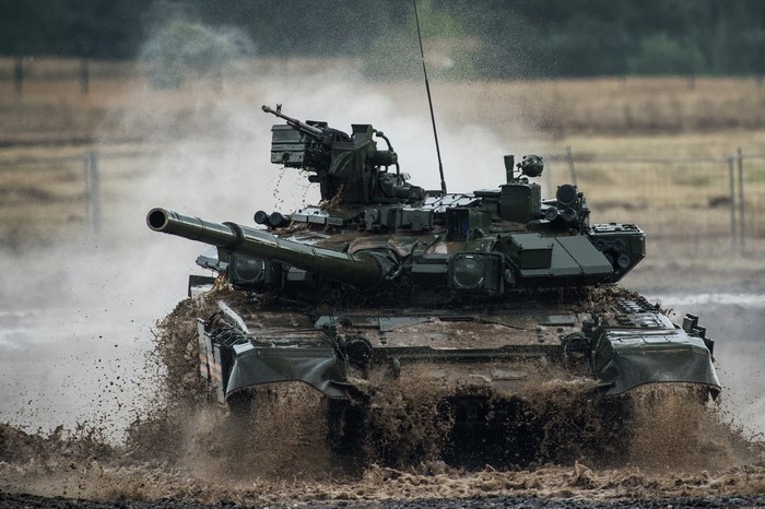 T-90 tank driving through mud and water