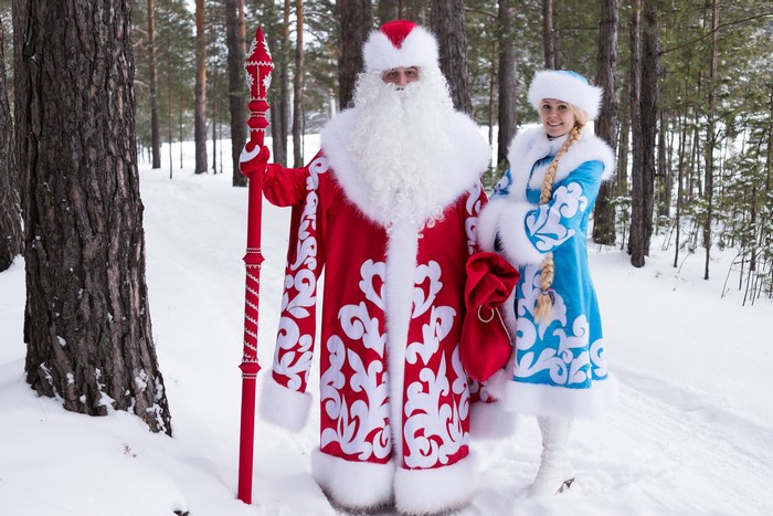 Santa Claus and Snow Maiden in a Snowy Forest