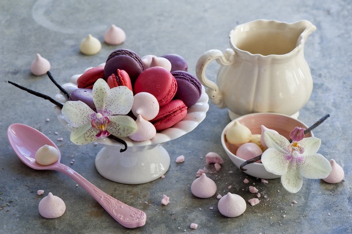 Macarons and meringues with orchids and vanilla beans