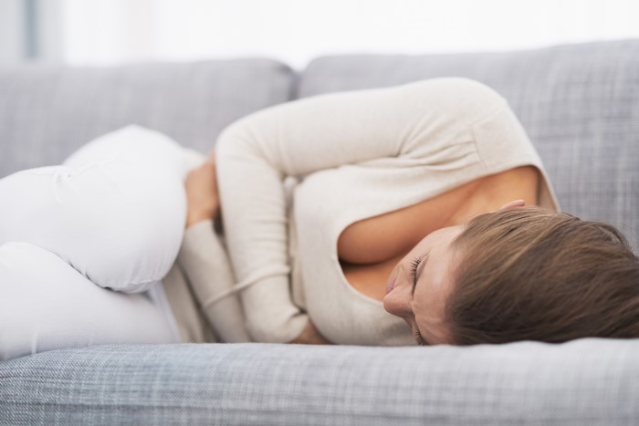 Woman lying on a couch