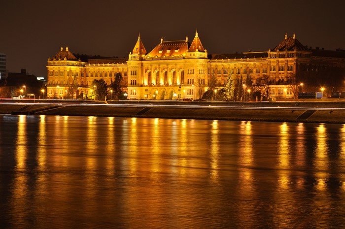 Illuminated building on a river at night in Budapest, Hungary