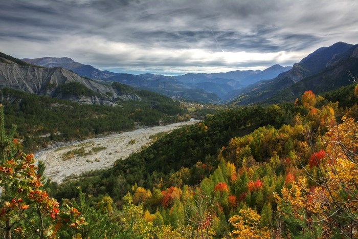 Autumn valley with mountains and river in France