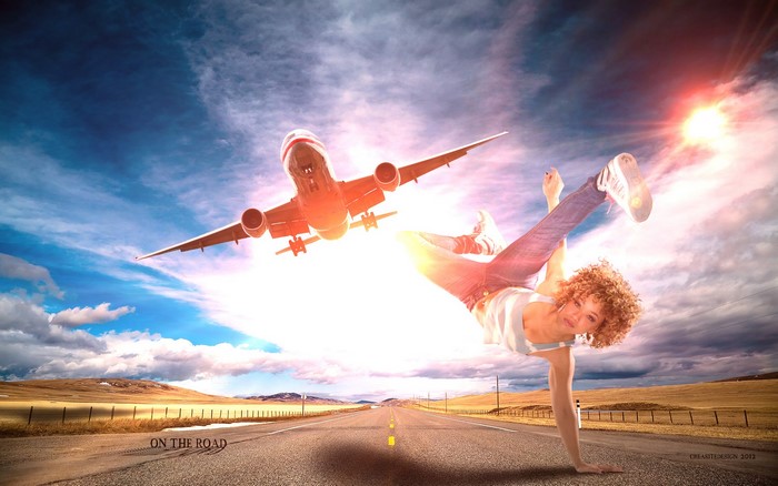 Airplane flying over a dancer on a road
