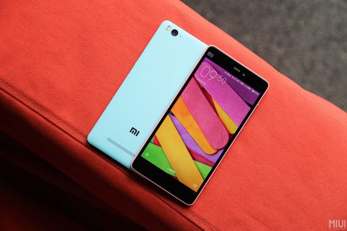 Xiaomi Mi 4c smartphones on orange surface
